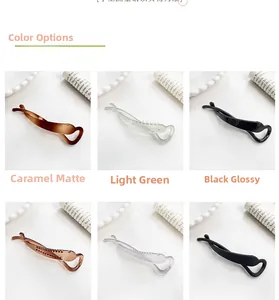 Detail view of six stylish banana hair clips in matte, glossy, and transparent finishes