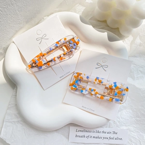 Japanese colorful polka dot acetate hair clip set on a decorative white tray