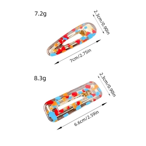 Set of colorful acetate hair clips in teardrop and rectangular shapes with vibrant dots