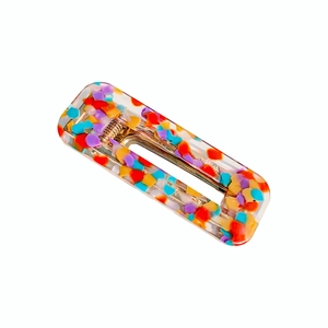 Rectangular colorful acetate hair clip with polka dot terrazzo texture on white background