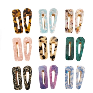 Set of 18 acetate hair clips featuring marble patterns and golden duckbill clips