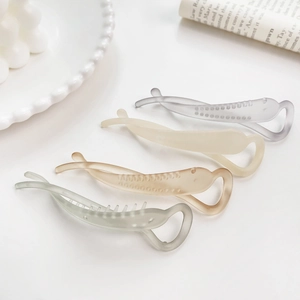 Set of four matte banana hair clips in Morandi colors with a sleek fishtail design