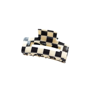 Classic black and white checkered acetate hair claw clip for women on a plain white background