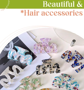 Detail of elegant hollow acetate hair claws in various marble and tortoiseshell patterns