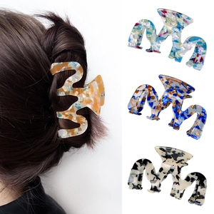 Fashionable wave-shaped acetate hair claw clips in four marble patterns for women