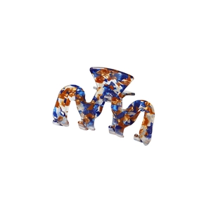 Blue and orange marbled acetate hair claw clip with stylish wavy cutout design