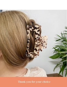 Detail view of a 13cm oversized marble tortoiseshell hair claw clip for thick hair