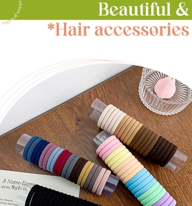 Macro detail of colorful thick elastic seamless hair ties set on a wooden surface