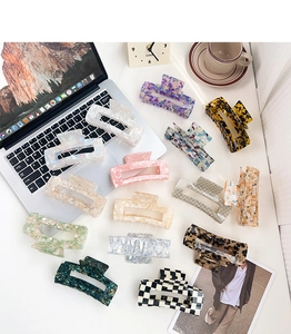Collection of thirteen large rectangular claw clips in various patterns and colors
