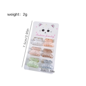 Lot de 6 mini barrettes papillon aux couleurs acidulées sur carte de présentation