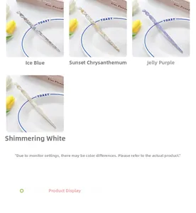 Detail view of acetate hair pins with marble patterns in blue, yellow, purple, and white