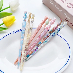 Modern acetate hair stick set with twisted design and colorful floral patterns for buns