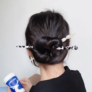 Modern acetate spiral hair sticks set in marble and white for elegant buns