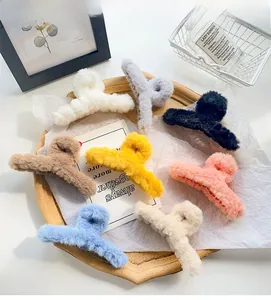 Detailed overhead view of plush winter hair claws in eight assorted trendy pastel colors