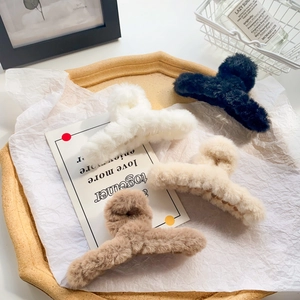 Faux fur hair claw clips in four colors: white, black, beige and coffee brown