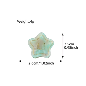 Star-shaped acetate hair claw clip with marble texture and smiley face detail
