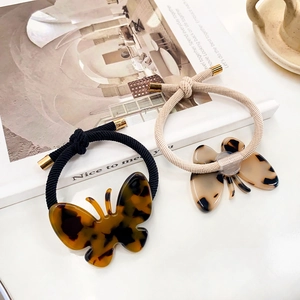 Élastiques à cheveux papillon en acétate avec motif écaille et cordons tressés