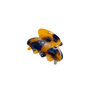 Minimalist tortoiseshell acetate small hair claw clip with polished finish and metal spring