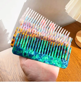 Detail showing various acetate shell hair combs with tortoiseshell and colorful patterns