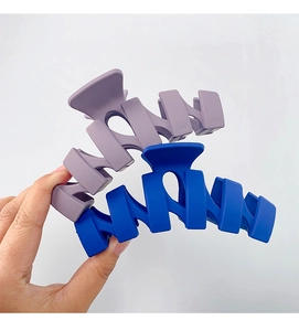 Close-up of 13cm matte purple and blue large hair claws for thick hair styling