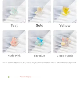 Detail view of cat-shaped hair clips in six colors with elegant marble textures