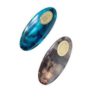 Set of two acetate hair clips in marble blue and smoky grey with gold metal accents