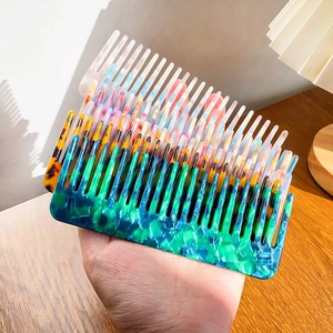 Three-piece colorful cellulose acetate wide-tooth combs with marble and tortoiseshell patterns