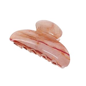 Minimalist marble pattern acrylic hair claw clip for women with peach and orange tones