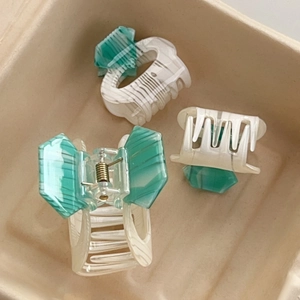Three-piece geometric acetate shark hair clips in mint green and marble white pattern