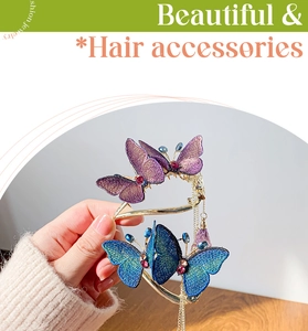 Exquisite embroidered butterfly hair clip with gold tassels and red gemstones details