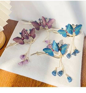 Detailed view of Chinese style butterfly hair clips with embroidery and long tassels