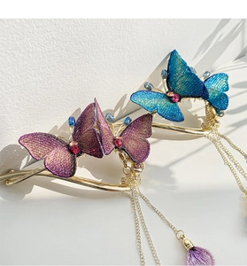 Detailed embroidery butterfly hair clips with sparkling rhinestones and golden tassels
