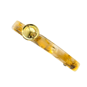French vintage acetate hair clip with amber leopard pattern and golden button detail