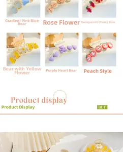 Detail of colorful resin hair claws with floral, bear, and fruit patterns in various pastel shades