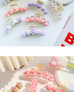 Detail of macaron hair claws with cute resin heart, bear, and fruit patterns for women