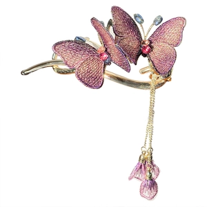 Embroidered butterfly hair clip with purple gradient finish and long golden tassels