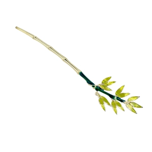 Bamboo style gold alloy hair pin with green enamel leaves on a clean white background