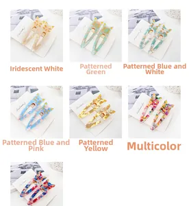 Detail showing various acetate cat hair clips in multiple colors on jewelry display cards