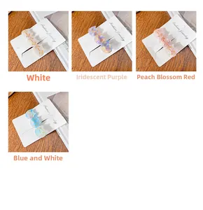 French style cat hair clips in four pearlescent colors displayed on cardboards