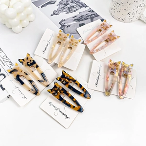 Cute cat acetate hair clips with tortoiseshell pattern on fashion jewelry card