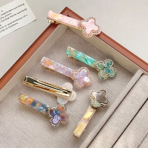 Set of 5 pastel acetate hair clips with golden French lettering and rhinestone clovers