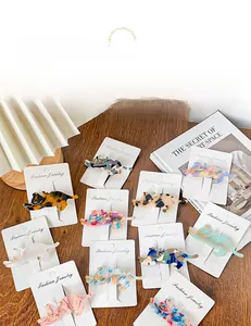 Flat lay of multiple acetate cat hair clips in various tortoise and marble patterns