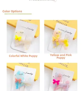 Detailed view of colorful acetate poodle hair clips with sparkling rhinestones