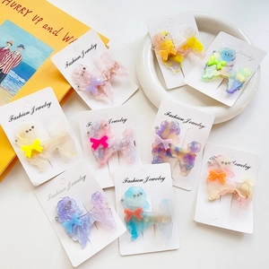 Sparkly acetate poodle hair clips with rhinestones in assorted macaron colors