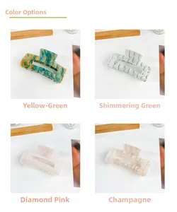 Detailed view of four marbled acrylic hair claws in green, pink, and champagne colors