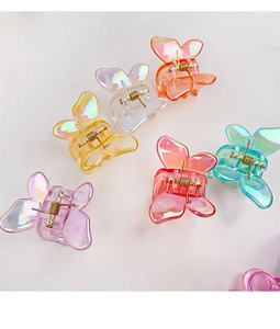 Détails de pinces à cheveux papillon colorées avec une finition nacrée irisante