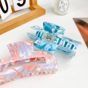Minimalist large acrylic hair claw clip with ink marble pattern in blue and pink tones