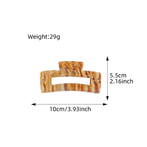 Large amber acetate hair claw clip with rectangular cutout and precise dimensions