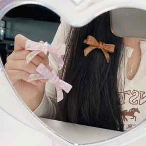 Elegant acetate bow hair clip set in pink marble and amber brown for women hair styling