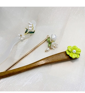 Detail of Lily of the Valley hair sticks in metal, resin, and wood for Hanfu styling